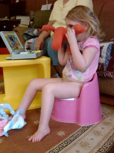 Katy on her potty chair with Muno